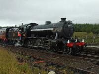 In the pouring rain 61994 <I>The Great Marquess</I> makes a water stop at Dalwhinnie. Summer has been cancelled this year. <br><br>[John Gray 18/08/2007]