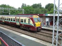 334008 pulls into Cartsdyke station on a service to Glasgow Central on 4 August 2007.<br><br>[Graham Morgan 04/08/2007]