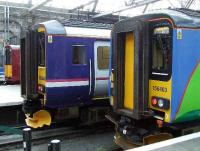 156446 and Central Trains liveried 156403 wait their turn to depart.<br><br>[Graham Morgan 28/07/2007]