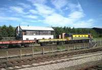 26004 stands alongside the sb north of Aviemore on 05 July 1991 with a pway train. <br><br>[John McIntyre 05/07/1991]