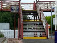 <i>Danger of tripping</i> warns the sign. There is also a sense of disorientation. Barry Links footbridge with old enamel sign.<br><br>[Brian Forbes /08/2007]