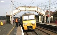 The morning North Berwick - Glasgow Central service stops at Carluke in March 2006.<br><br>[John Furnevel 10/03/2006]