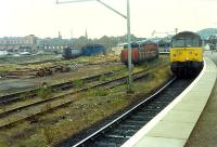 The now swept away goods yard at Inverness. By this time the southern loading banks were in use as a carpark, the shed was in use as a Lynx truck depot and the northern sidings in use for timber.<br><br>[Ewan Crawford //1989]