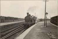 Georgemas Junction - Britains furthest north junction. HR 4.4.0 14399 <i>Ben Alder</i> at Thurso platform.<br><br>[G H Robin collection by courtesy of the Mitchell Library, Glasgow 03/07/1950]