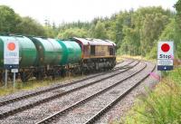 At that time the only regular scheduled freight north of Inverness - 66111 propels the 0807 (Fridays only) Inverness - Lairg oil tanks into the depot on 31 August 2007.<br><br>[John Furnevel 31/8/2007]