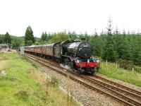 61994 accelerates away from Tulloch. Crossing Rannoch Moor has not done the floral wreath any good and its battered remains hang from the smokebox door.<br><br>[John Gray 01/09/2007]