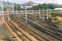 Having a quick look at the condition of the track in the yard - a train is down at James Watt Dock. The (then) recently lifted loop to the left was sometimes used for train arrivals.//16472,16476,16474,16475,16455,16477<br><br>[Ewan Crawford //1988]