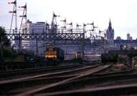 A 47 brings a train for Kings Cross out of Aberdeen in July 1974 as a class 08 propels empty stock back towards the station.<br><br>[John McIntyre /07/1974]