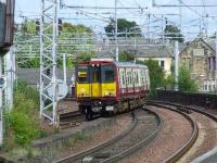 314208 crossing Wallneuk Junction with a Gourock service about to pull into Platform 2 at Paisley Gilmour Street.<br><br>[Graham Morgan 31/08/2007]