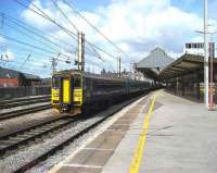 Class 153 and 156 on a service to York head south out of Preston on 6 April.<br><br>[John McIntyre 06/04/2007]