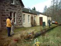 Dunphail Station Masters house to the left and the station building.  The current owner is pictured next to Mrs Tomlins.  The last station master was Mr Pozy, who lived at Ferry Road, about 5 miles away.<br><br>[Matt Jolley /4/2007]