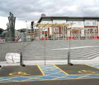 Work on the station at Alloa continues with a new sculpture now standing alongside the station steps, seen here on 13 September 2007. The 4.5 metre high work by Glasgow based artist Andy Scott shows a man looking up at a child and represents <I>'looking to the future'</I>.<br><br>[John Furnevel 13/09/2007]