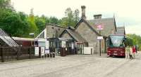 Passengers from <i>The Royal Scotsman</i> standing in Dunkeld station transfer from train to bus for a visit to Glamis Castle.<br><br>[Brian Forbes 13/09/2007]