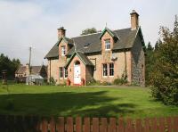 The imposing former station masters house at Moy on 1 September 2007. The southern end of the station building can be seen in the left background.<br><br>[John Furnevel 01/09/2007]