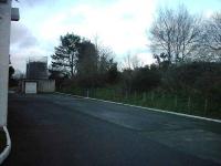 The rear of Dallas Dhu distillery.  The trackbed (now the Dava way) behind the building.  The siding descended down from the track, North of the distillery.<br><br>[Matthew Tomlins /04/2007]