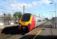 Leyland station on 22 May as a Voyager passes through on the down fast line.<br><br>[John McIntyre 22/5/2007]