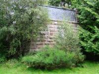 Amongst the trees on the north side of Loch Fleet on 31 August stands the northern abutment of the bridge that carried the Dornoch branch over the narrows and onto the causeway [see image 9211]. The Mound station lies just beyond. <br><br>[John Furnevel 31/08/2007]