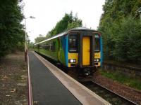 156403 in Central Trains livery pulls up at the platform on a Glasgow Central service on 15 September.<br><br>[David Panton 15/9/2007]