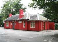 Station frontage at Dornoch from across Station Road. The brightly painted retail premises are currently for sale.<br><br>[John Furnevel 26/08/2007]