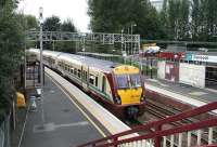 A Glasgow bound train pulls away from Dalreoch station on 9 September.<br><br>[John Furnevel /09/2007]