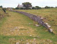 View north along the platform remains at Ulbster on 28 August. The station building stands in the background.<br><br>[John Furnevel 28/8/2007]