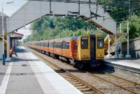 Class 314s heading for Milngavie at Bearsden in June 1997.<br><br>[David Panton /6/1997]