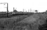 A 6-car service for Helensburgh photographed in 1972 from the old goods loading bank at Cardross.<br><br>[John McIntyre 18/9/1972]