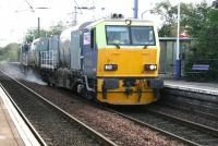 Network Rail RHTT unit DR98958, specialising in the removal of leaves and oil residues, heading out of Edinburgh through Wester Hailes station with all systems operational on 4 October 2007. Possibly a releaf working... (sorry)<br><br>[John Furnevel 04/10/2007]