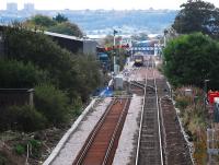 Looking towards Dyce from Raiths Farm. The extending of the Dyce loop is obvious. Also obvious are the semaphore signals and their colour light replacements - presumably to be controlled by Dyce box (in distance). A service from the south terminates in the station.<br><br>[Ewan Crawford 07/10/2007]