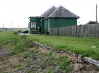 Approaching the Lybster terminus of the Wick and Lybster Light Railway on 28 August. The former station building still stands along with partial remains of the old wooden-faced platform.<br><br>[John Furnevel 28/8/2007]