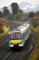 170 407 in ScotRail livery heads south near Cowie on 9 October. Stirling Castle stands in the background.<br><br>[Bill Roberton 09/10/2007]