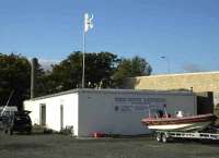 The former Burntisland control bunker on 12 October with the new Lammerlaws Bridge (now open) in the background.<br>
[Railscot Note: The <I>Burntisland Emergency Railway Control Centre</I> was part of a proposed network of 30 such emergency centres planned by the BR Board in the early 1950s and was constructed in 1955. The building, a single storey blast protected blockhouse, was never fitted out and is one of only 4 built before the plans were shelved in 1956. The other 3 were built at Brickett Wood, Knebworth and Huyton Junction. The bunker now houses a diving shop.]<br><br>[Bill Roberton 12/10/2007]