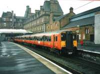318261 stands at Ayr platform 1 in April 1998 just about to leave with a service for Glasgow Central.<br><br>[David Panton /04/1998]