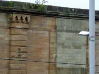 The bricked up entrance in the wall at Greenock Central to the right shows where a pedestrian bridge at one time crossed over the station, along with still intact bridge number and roof beam support.<br><br>[Graham Morgan 11/09/2007]