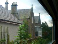 The old Beauly station buildings seen from a train on 22 September. Looking towards Inverness.<br><br>[Brian Forbes 22/09/2007]