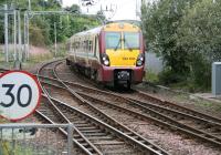 The Sunday morning 10.39 Balloch - Motherwell service approaching the junction with the Helensburgh line at Dalreoch on 9 September 2007.<br><br>[John Furnevel 09/09/2007]