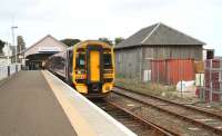 Afternoon train for Inverness standing at Thurso on 28 August, alongside a surviving goods shed.<br><br>[John Furnevel 28/08/2007]