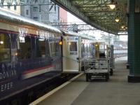 Catering staff clearing the empty Glasgow Central portion of the Caledonian Sleeper prior to it being taken to Polmadie.<br><br>[Graham Morgan 15/09/2007]