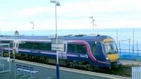 Kinghorn Station. A 170 calls with an Edinburgh service. Behind the train is a choppy Firth of Forth.<br><br>[Brian Forbes //2007]