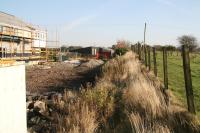 Site of Crook of Devon station on 23 October 2007 looking east over the former level crossing and on towards Kinross. The platform and station building stood on the left (north side of the line) and behind that was the goods yard, currently a building site. <br><br>[John Furnevel 23/10/2007]