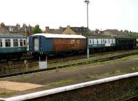 Old carriages in the sidings to the west of Perth station in July 1991, including an ex-LNER parcels brake and a mk 1 sleeping car with a sign on the side reading <I>Fulmar Express</I>.<br><br>[John McIntyre 06/07/1991]