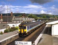 Arrival from the north pulls up at Dingwall on 15 August 1989, seen from the station footbridge.<br><br>[John McIntyre 15/08/1989]