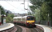 Having just crossed the bridge over the River Leven on the short section from Dumbarton Central, 320305 runs into Dalreoch on 9 September with a westbound service destined for Helensburgh.<br><br>[John Furnevel /09/2007]