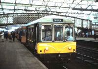 A DMU destined for Skipton via the Settle & Carlisle line, resplendent in <I>Heritage</I> livery, stands at Carlisle station in March 1987<br><br>[David Panton /03/1987]