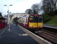 Having reversed at the south end of Neilston station on 10 November, 314 208 picks up passengers for the return journey to Glasgow Central.<br><br>[David Panton 10/11/2007]