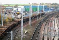 A class 60 takes a lengthy spoil train north on the freight lines towards Kingmoor yard past the DRS depot on Saturday afternoon 3 November 2007.<br><br>[John Furnevel 03/11/2007]