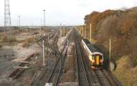 Looking north on the WCML over the remains of the once mighty Kingmoor marshalling yard on 3 November, with the last of the buildings that stood alongside the up departure sidings now demolished.<br><br>[John Furnevel 03/11/2007]