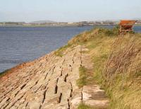 View north across the Solway Firth on 6 November showing the remains of the embankments that once supported the Solway viaduct. The metal structure top right is/was used by cockle gatherers in the area.  <br><br>[John Furnevel 06/11/2007]