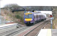 Class 170 departing Queen Margaret station for Cowdenbeath on 17th November. Note the platform extension to 6 cars, and the feathers on the starting signal for the Townhill goods loops ahead of the train.<br>
The overhead bridge is barricaded out of use.<br><br>[Brian Forbes 17/11/2007]