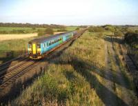 A Blackpool North service west of Kirkham on 12 September. The tracks on the right once carried trains to Blackpool Central.<br><br>[John McIntyre 12/09/2007]